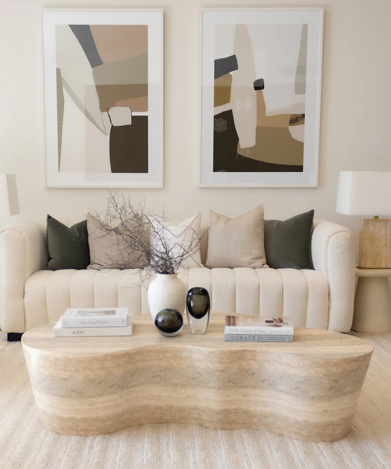 Neutral modern living room with layered textures and art